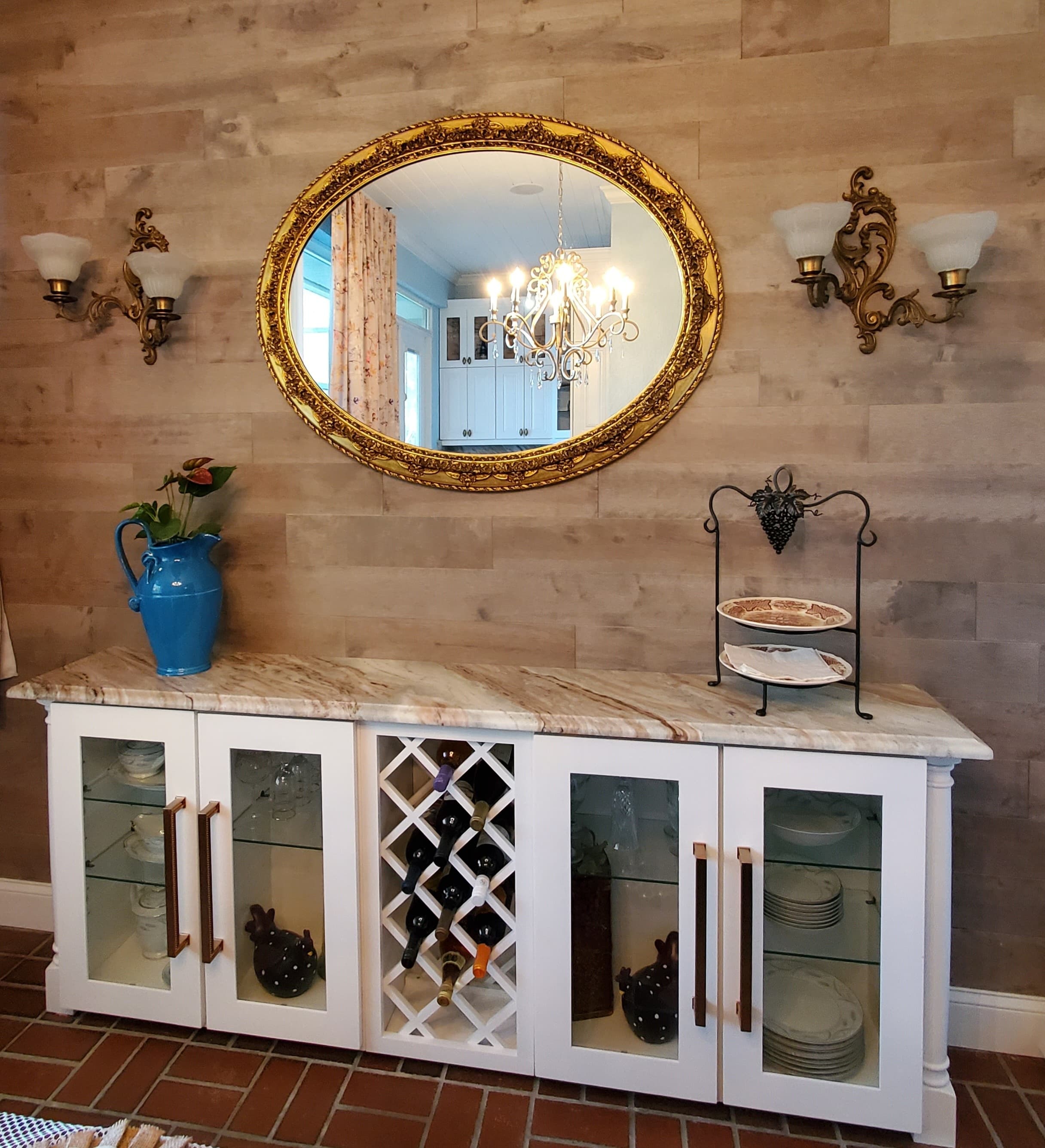 White wine bar with glass-front display cabinets, a center lattice wine rack, and a marble countertop