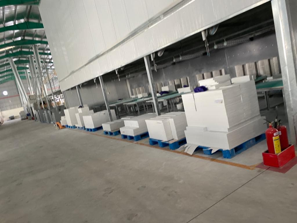 Grey shaker cabinet bodies on production line