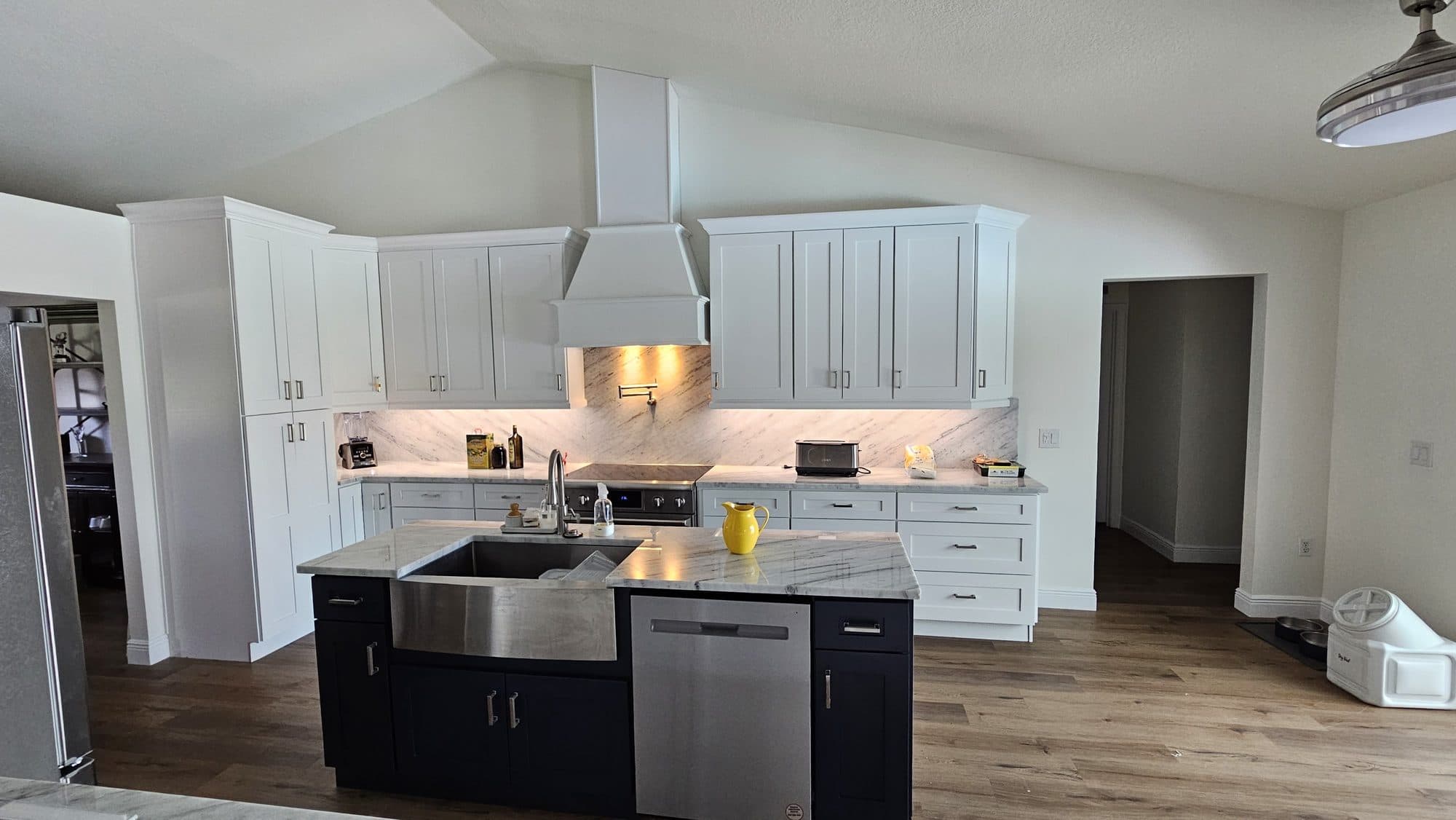 White Kitchen with Navy Island and Farmhouse Sink