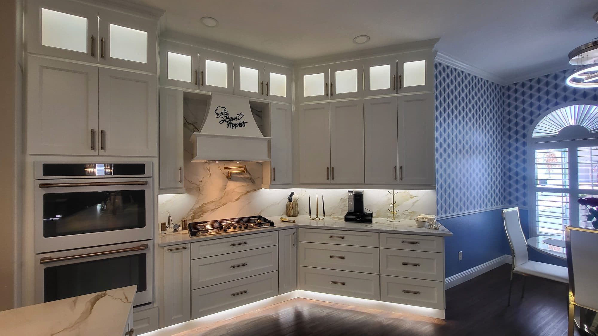 White Range Wall with Lighted Glass Uppers