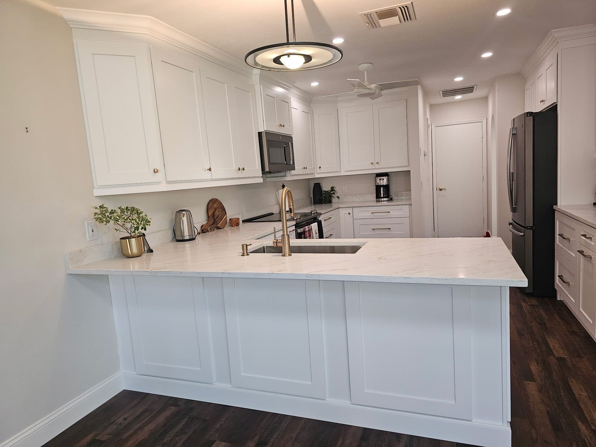 White Kitchen with Paneled Peninsula