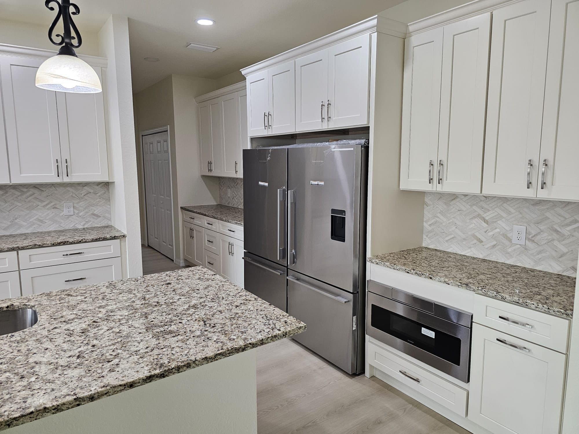 White Kitchen with Granite Island