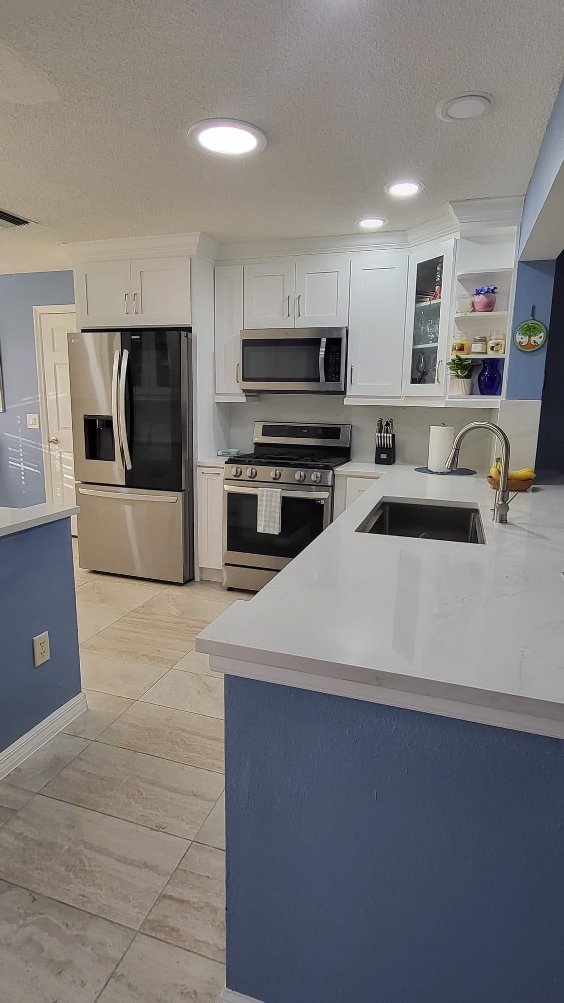 White Kitchen with Blue Peninsula