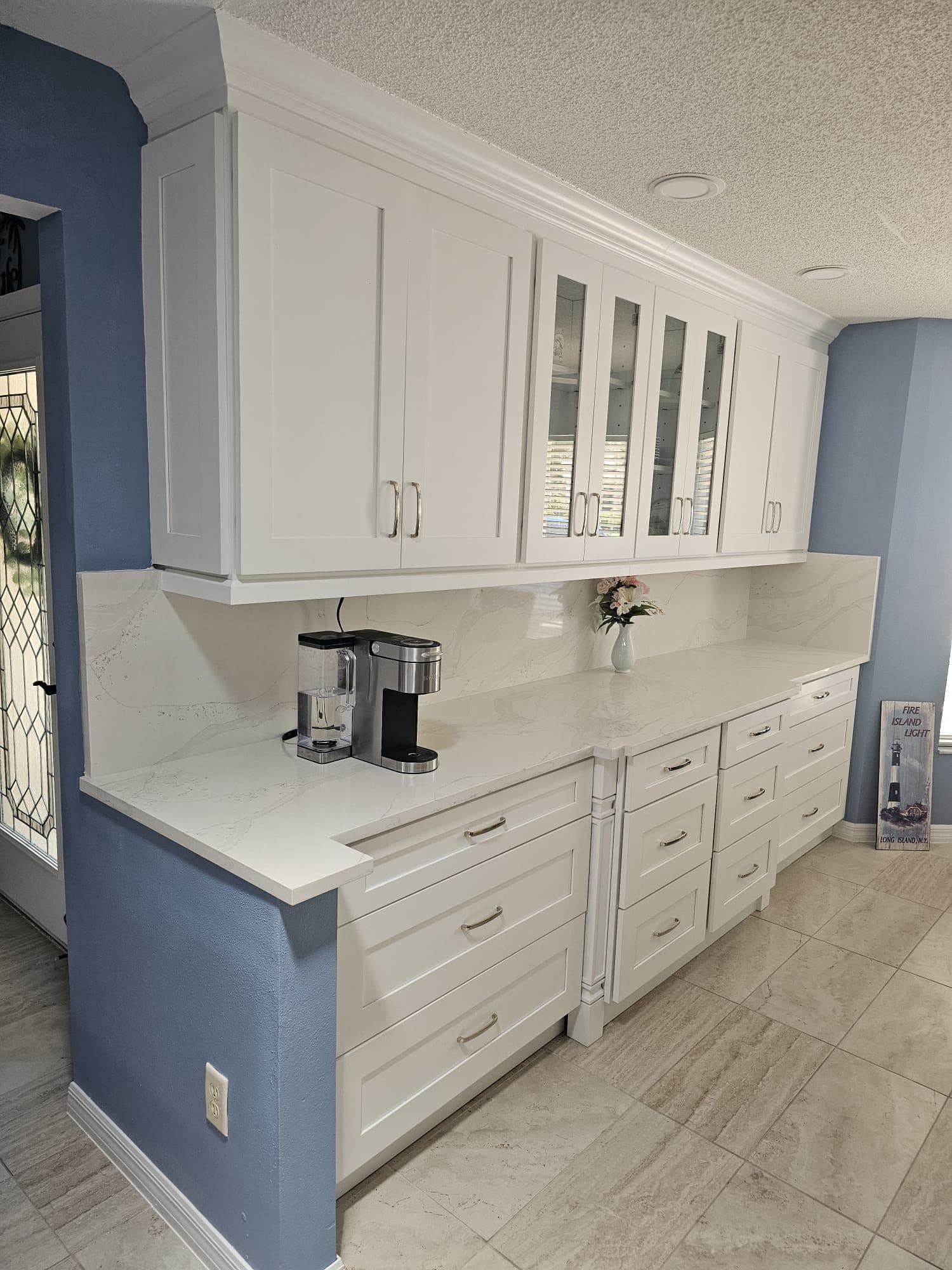 White Kitchen with Glass Uppers and Coffee Station