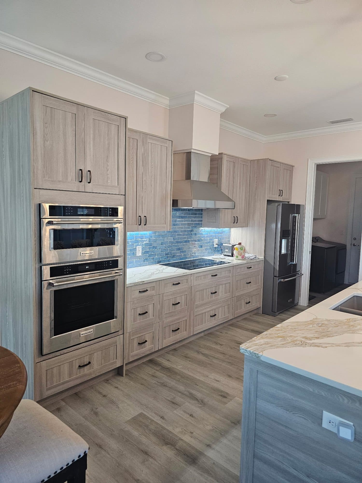 Gray Woodgrain Kitchen with Wall Ovens