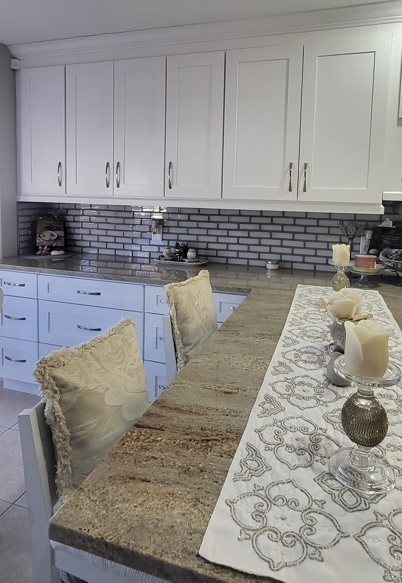 Granite Breakfast Bar with White Cabinets