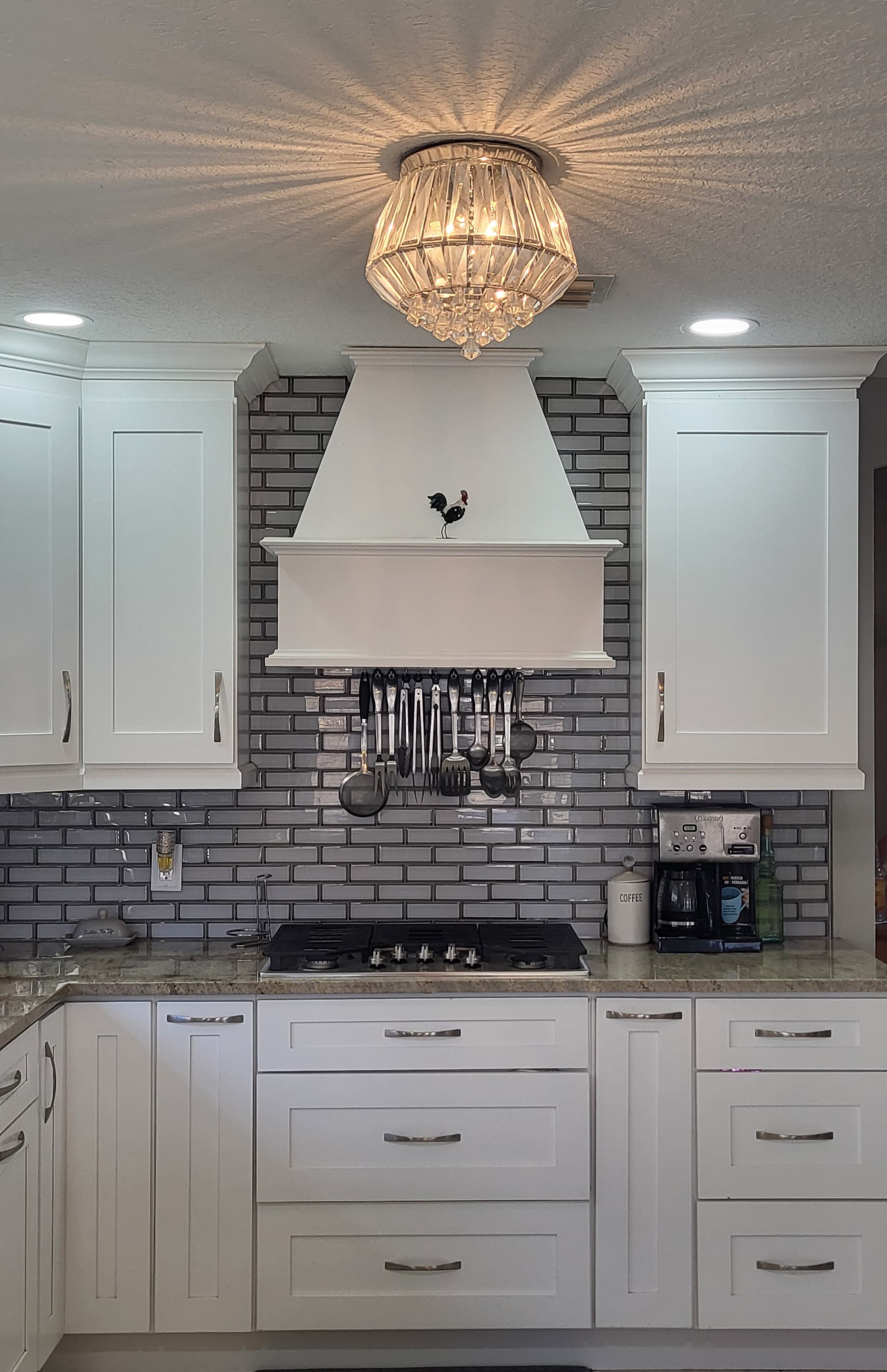 White subway tile kitchen with hood
