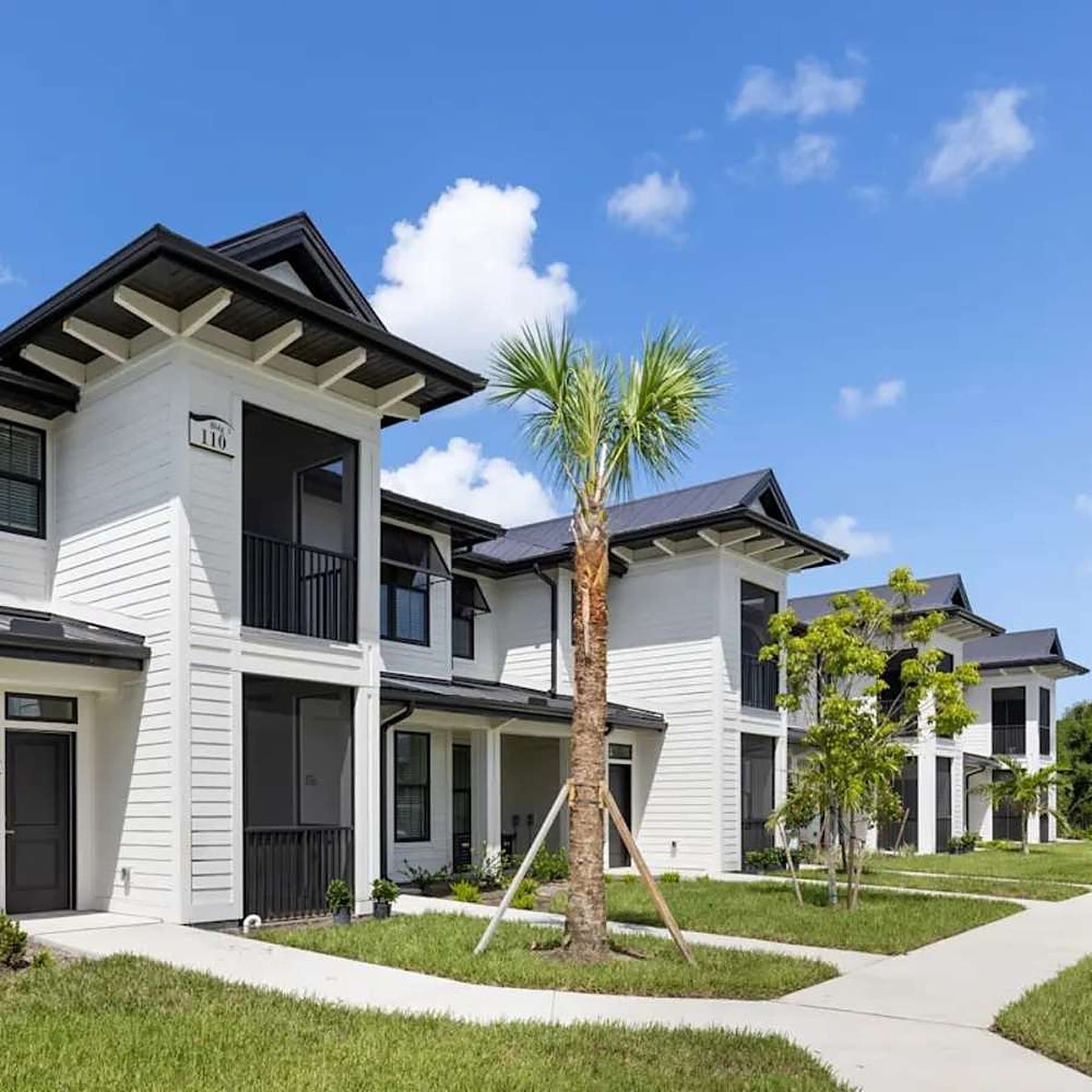 Two-story apartment building with screened lanais at The Waterfront on Hatchett Creek