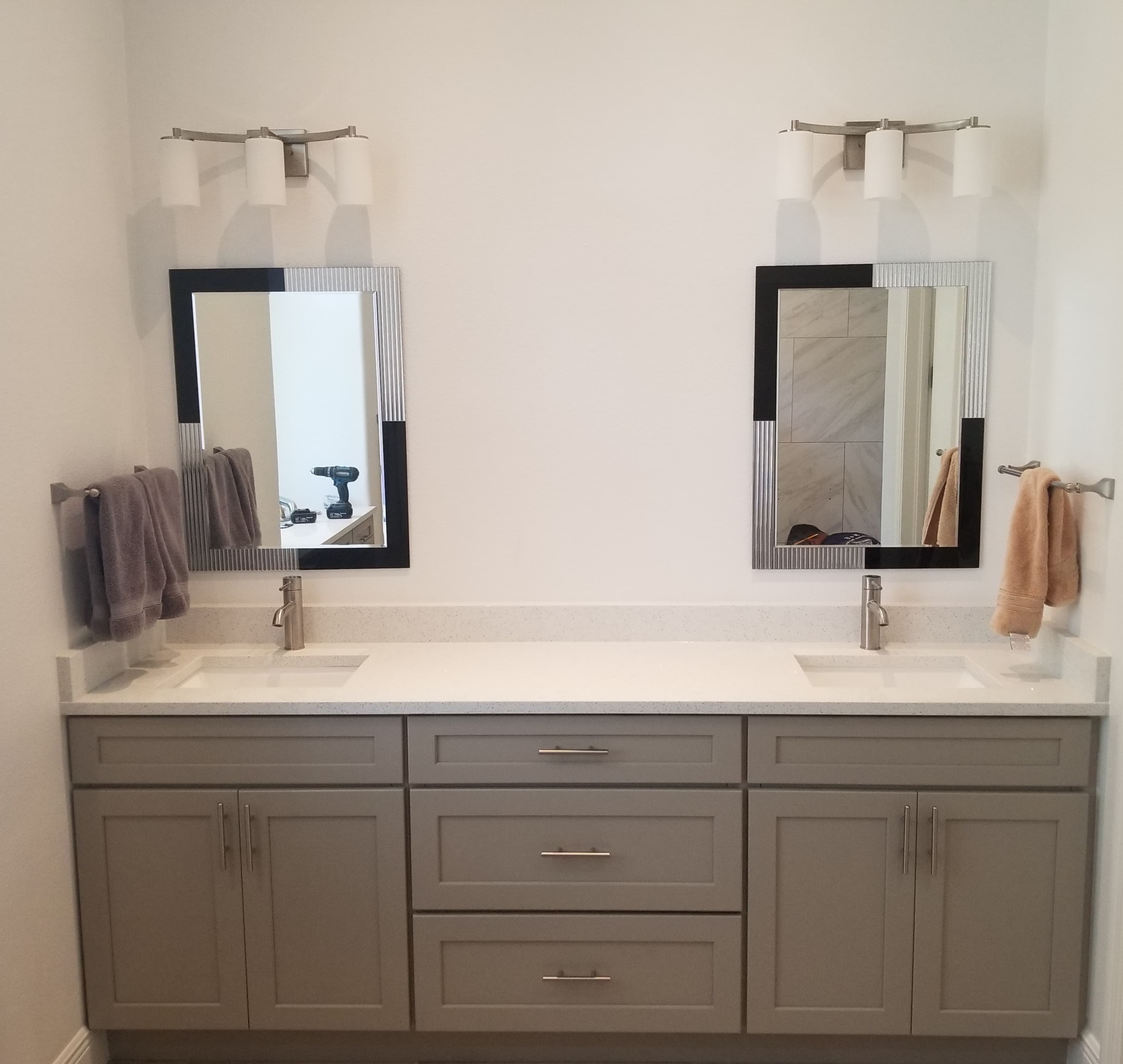 Double-sink grey shaker vanity with modern mirrors