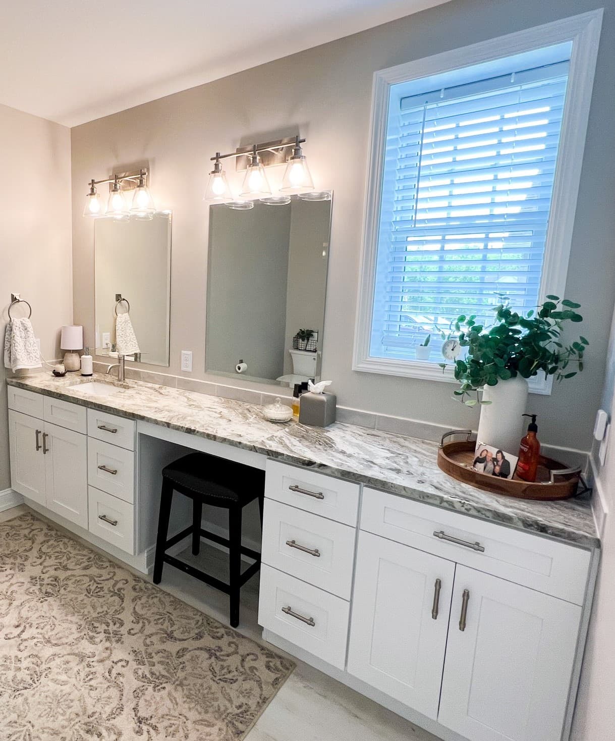 White shaker double vanity with makeup station